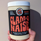 hand holding jar of clam-o-naise